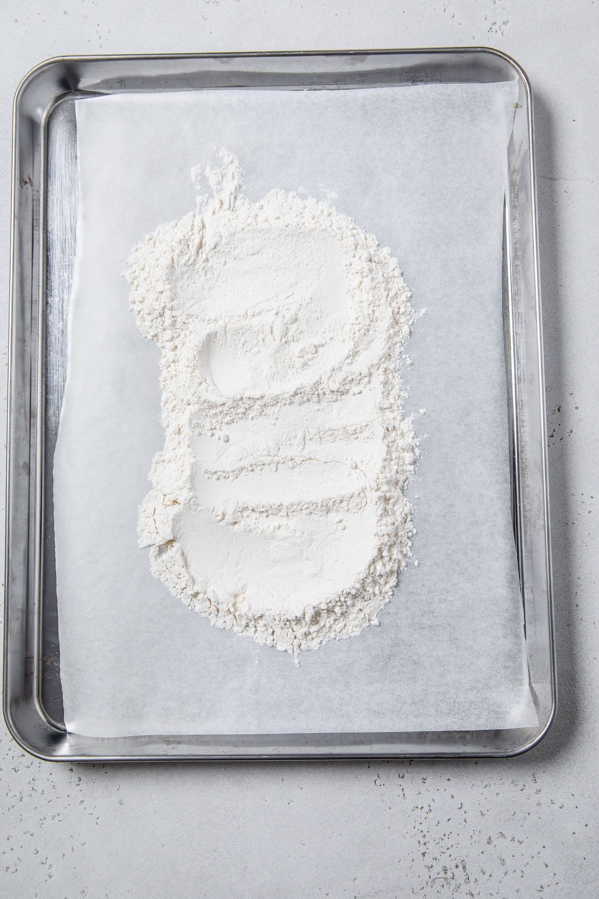 flour on a parchment lined baking sheet